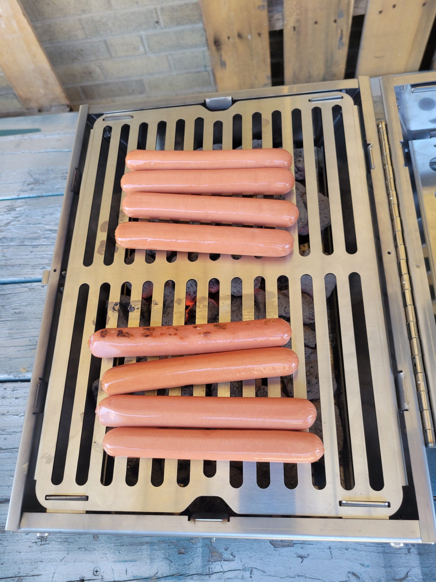 tsm-heavy-duty-portable-tool-box-grill;TSM-Toolbox-Charcoal-Grill-Infographic;side_view_of_the_portable_TSM_tool_box_grill;closed_position_of_the_tool_box_grill;21-lb-heavy-duty-portable-grill-to-last-a-lifetime;cooking_sausages_on_grill;some_vegetables_and_chicken_wings_on_TSM_tool_box_grill