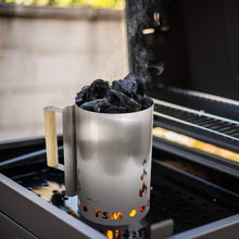 sausage-maker-charcoal-starter-for-grill;firing-up-coal-in-charcoal-starter;inside-view-charcoal-chimney-starter;safe-wooden-handle-of-the-chimney-starter