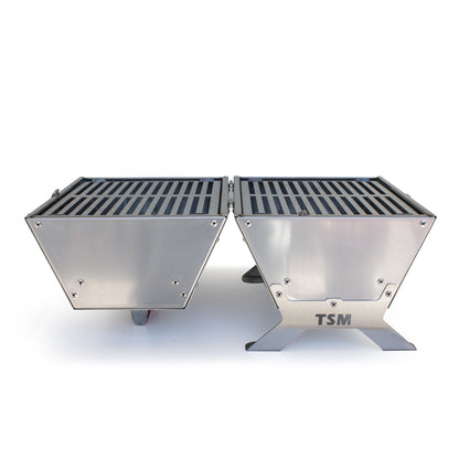 tsm-heavy-duty-portable-tool-box-grill;TSM-Toolbox-Charcoal-Grill-Infographic;side_view_of_the_portable_TSM_tool_box_grill;closed_position_of_the_tool_box_grill;21-lb-heavy-duty-portable-grill-to-last-a-lifetime;cooking_sausages_on_grill;some_vegetables_and_chicken_wings_on_TSM_tool_box_grill